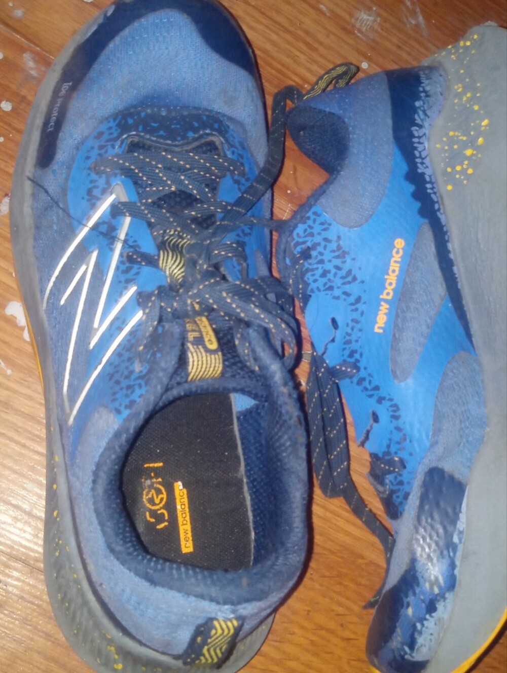 New Balance Blue and Black Athletic Sneakers with Yellow Accents